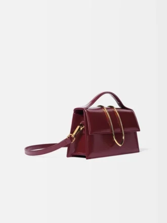 El bolso grande con solapa metálica Bambino Cross-body