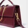 El bolso grande con solapa metálica Bambino Cross-body El bolso grande con solapa metálica Bambino Cross-body