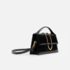 El bolso grande con solapa metálica Bambino Cross-body El bolso grande con solapa metálica Bambino Cross-body