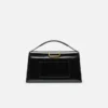 El bolso grande con solapa metálica Bambino Cross-body El bolso grande con solapa metálica Bambino Cross-body