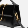 El bolso grande con solapa metálica Bambino Cross-body El bolso grande con solapa metálica Bambino Cross-body