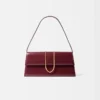 El bolso largo Bambino Bolso largo con solapa metálica El bolso largo Bambino Bolso largo con solapa metálica