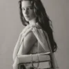 El bolso largo Bambino Bolso largo con solapa metálica