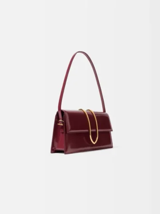 El bolso largo Bambino Bolso largo con solapa metálica
