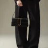 El bolso largo Bambino Bolso largo con solapa metálica El bolso largo Bambino Bolso largo con solapa metálica