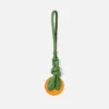 El charm naranja con forma de nudo El charm naranja con forma de nudo
