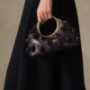 El pequeño Calino con nudos Bolso de mano con mini anilla El pequeño Calino con nudos Bolso de mano con mini anilla